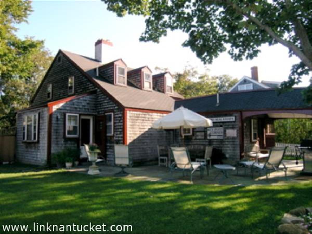 16 Vestal Street Nantucket, MA 02554 - Photo 1 of 10 a view of a house with a yard porch and sitting area