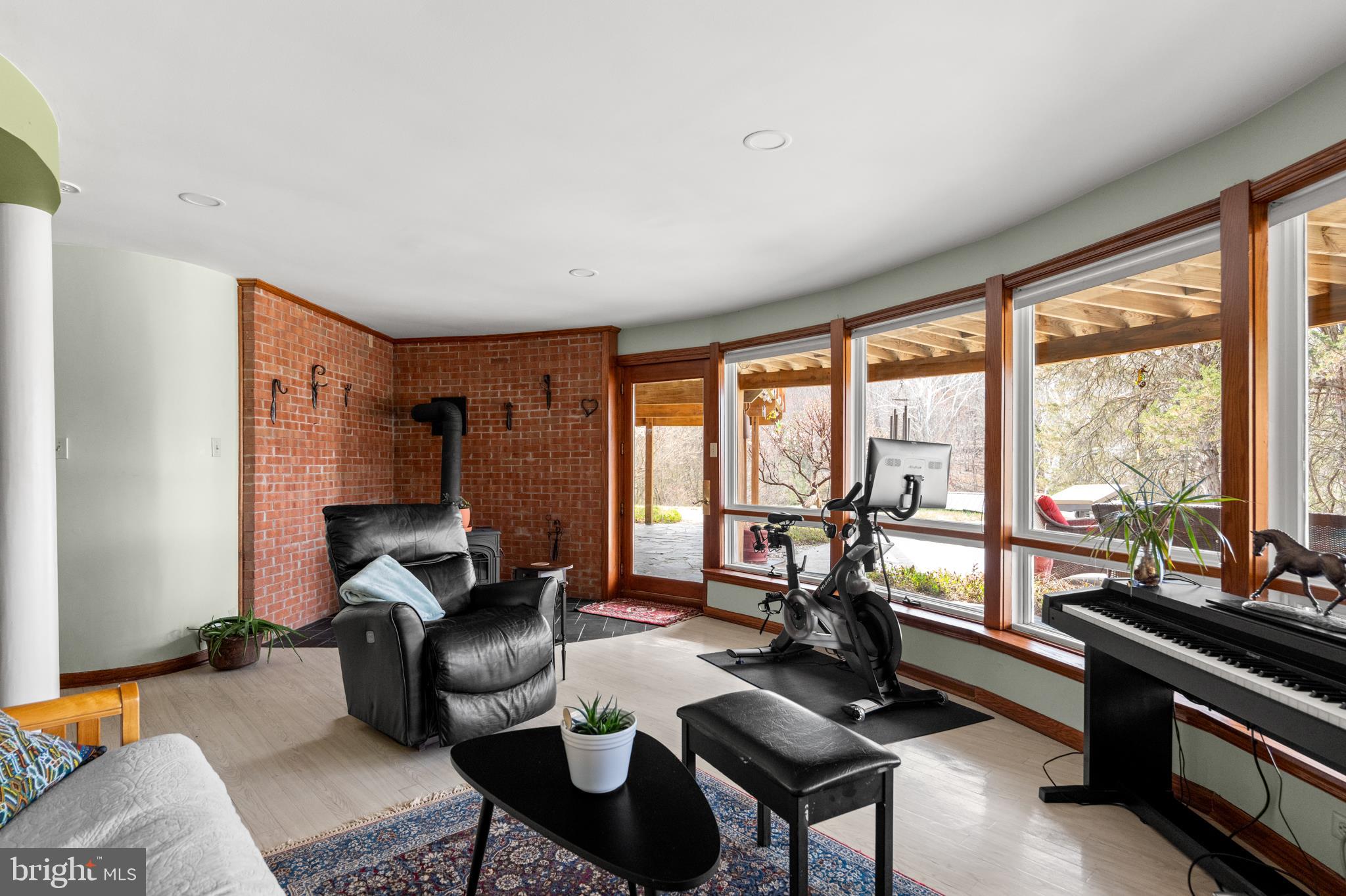 10803 Crest Hill Road Marshall, VA 20115 - Photo 13 of 30 a living room with furniture and floor to ceiling windows