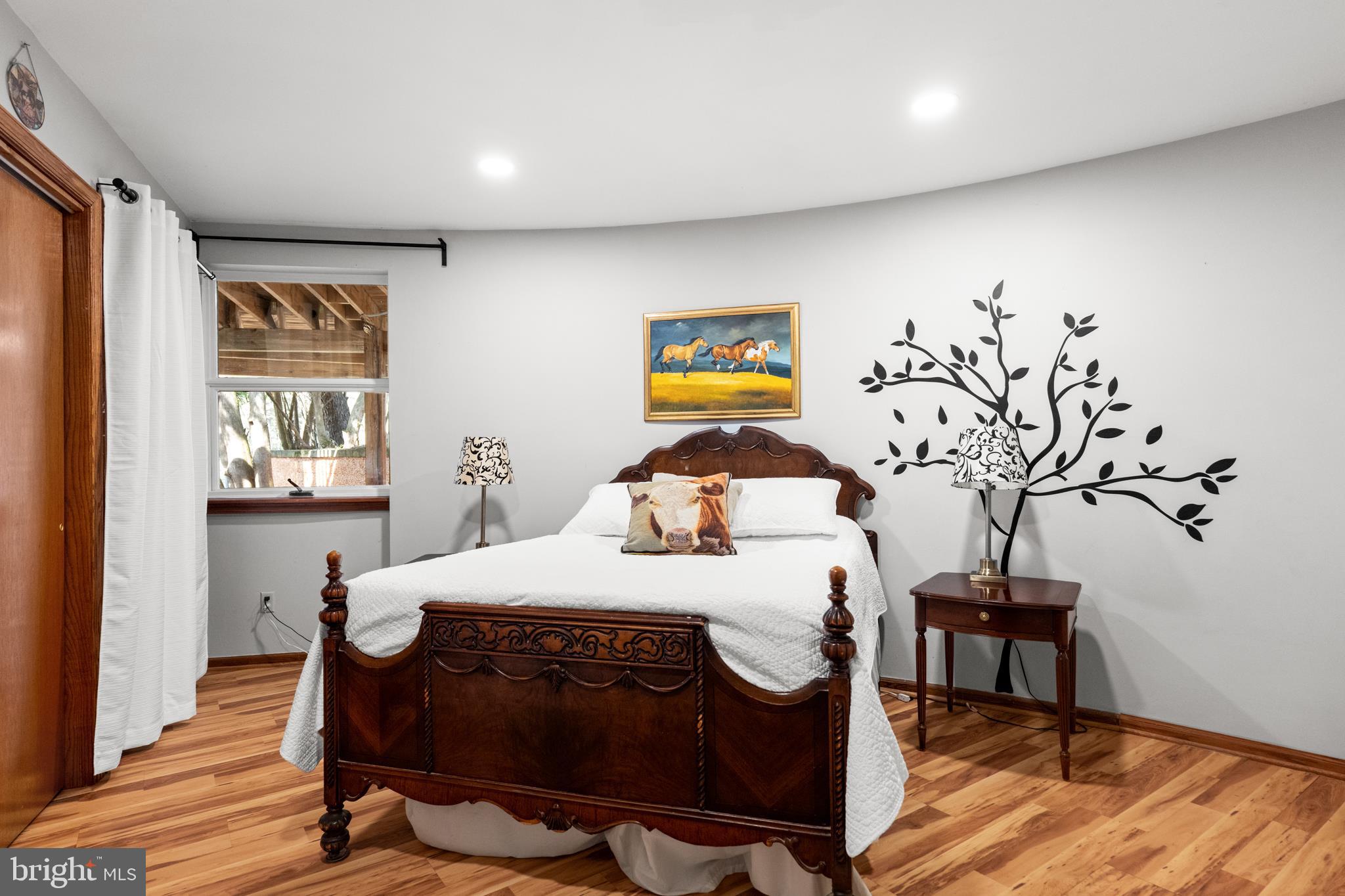 10803 Crest Hill Road Marshall, VA 20115 - Photo 14 of 30 a bedroom with a bed and wooden floor