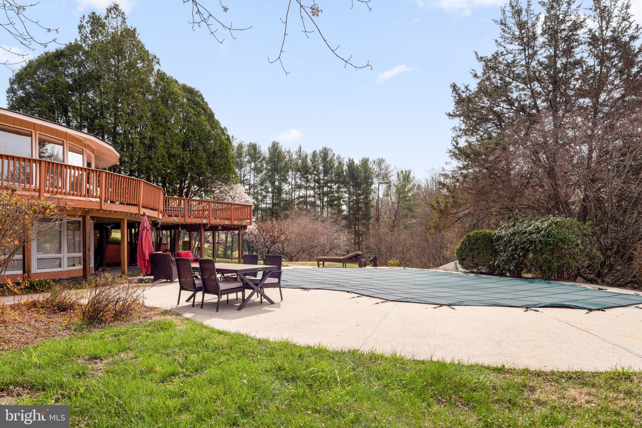 10803 Crest Hill Road Marshall, VA 20115 - Photo 19 of 30 a view of a patio with a table and chairs