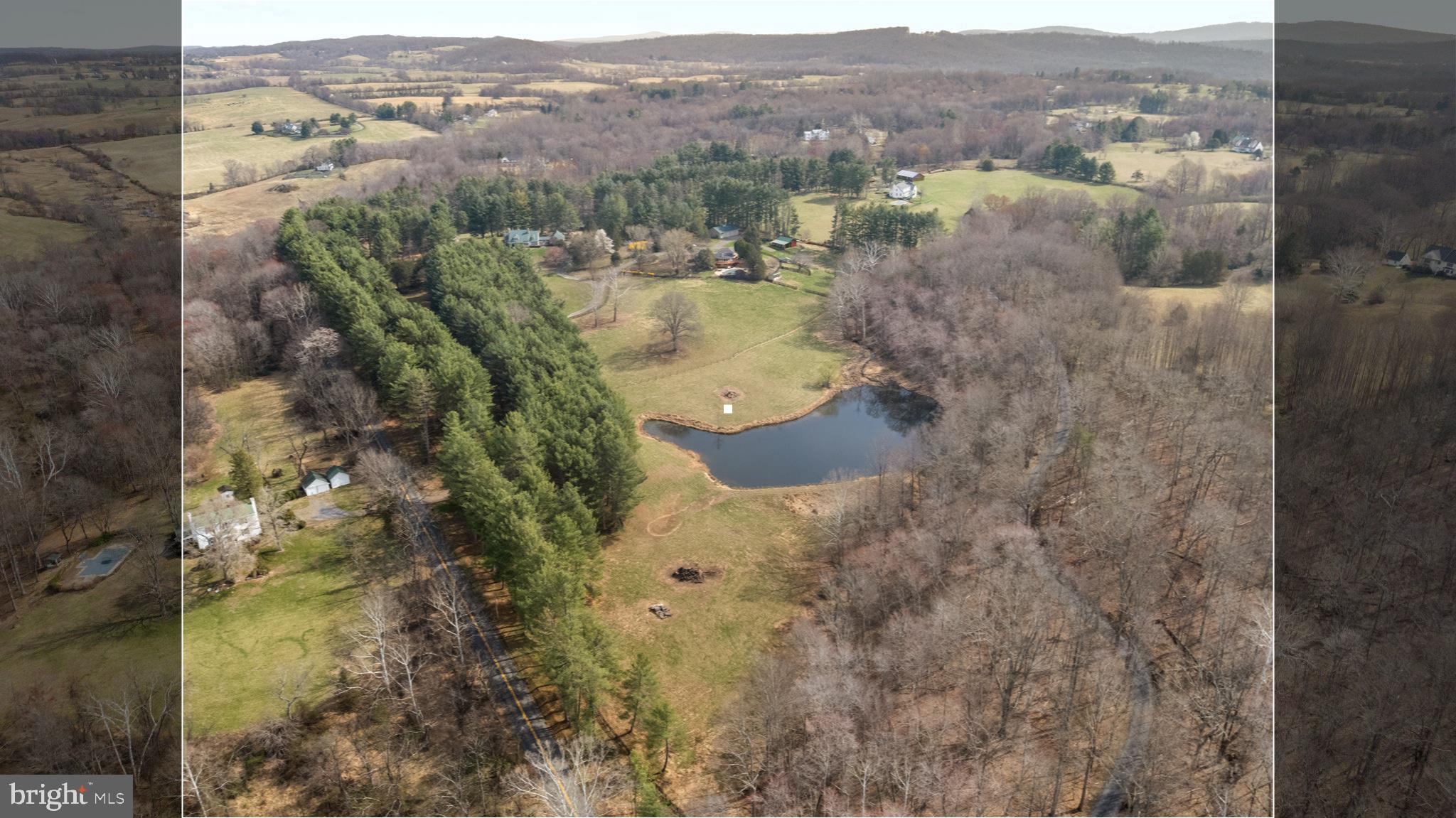 10803 Crest Hill Road Marshall, VA 20115 - Photo 30 of 30 a view of a bathroom with a sink and mirror