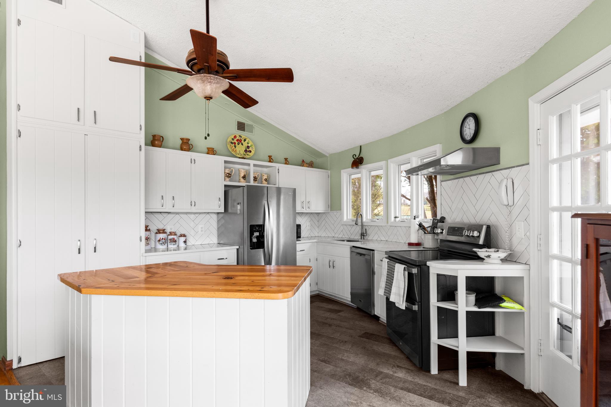 10803 Crest Hill Road Marshall, VA 20115 - Photo 8 of 30 a kitchen with stainless steel appliances granite countertop a sink and white cabinets