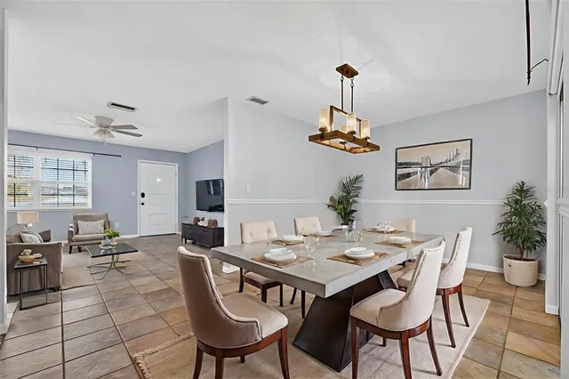 a kitchen with stainless steel appliances granite countertop a sink and a stove