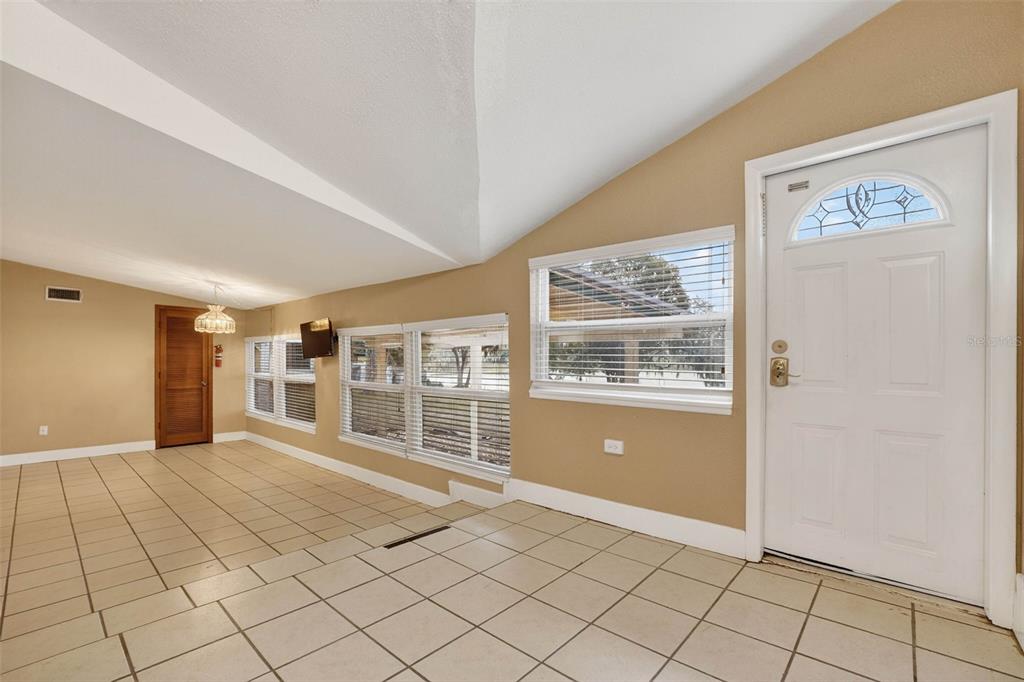 309 North 8th Street Dundee, FL 33838 - Photo 28 of 91 a view of an empty room with window and cabinet