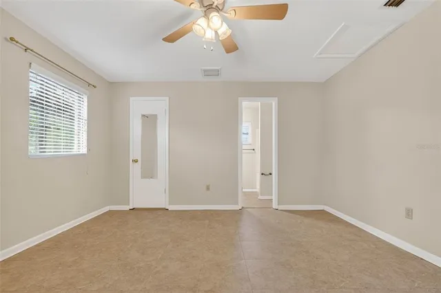 a bedroom with bed and a flat screen tv