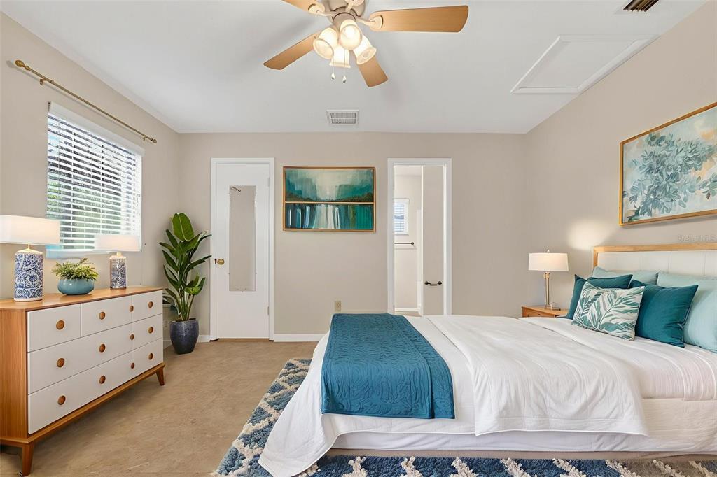 309 North 8th Street Dundee, FL 33838 - Photo 35 of 91 a bedroom with a bed and a dresser