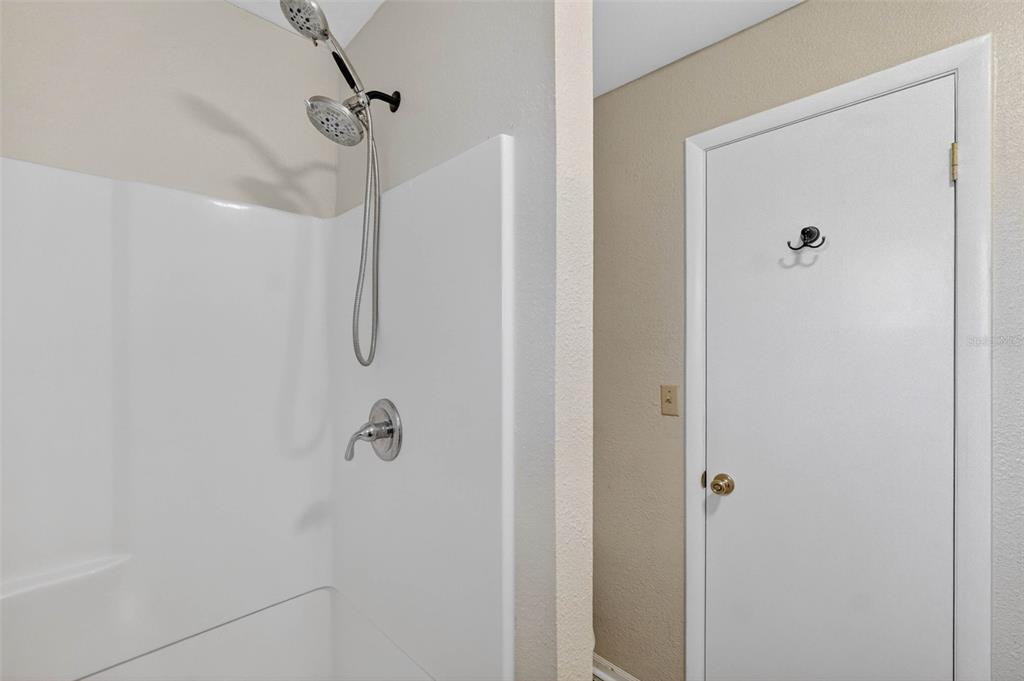 309 North 8th Street Dundee, FL 33838 - Photo 44 of 91 a bathroom with a shower