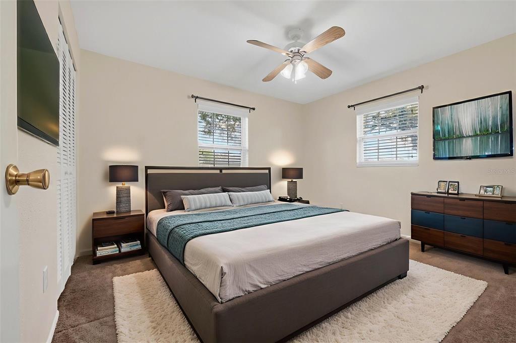 309 North 8th Street Dundee, FL 33838 - Photo 58 of 91 a bedroom with bed and a flat screen tv