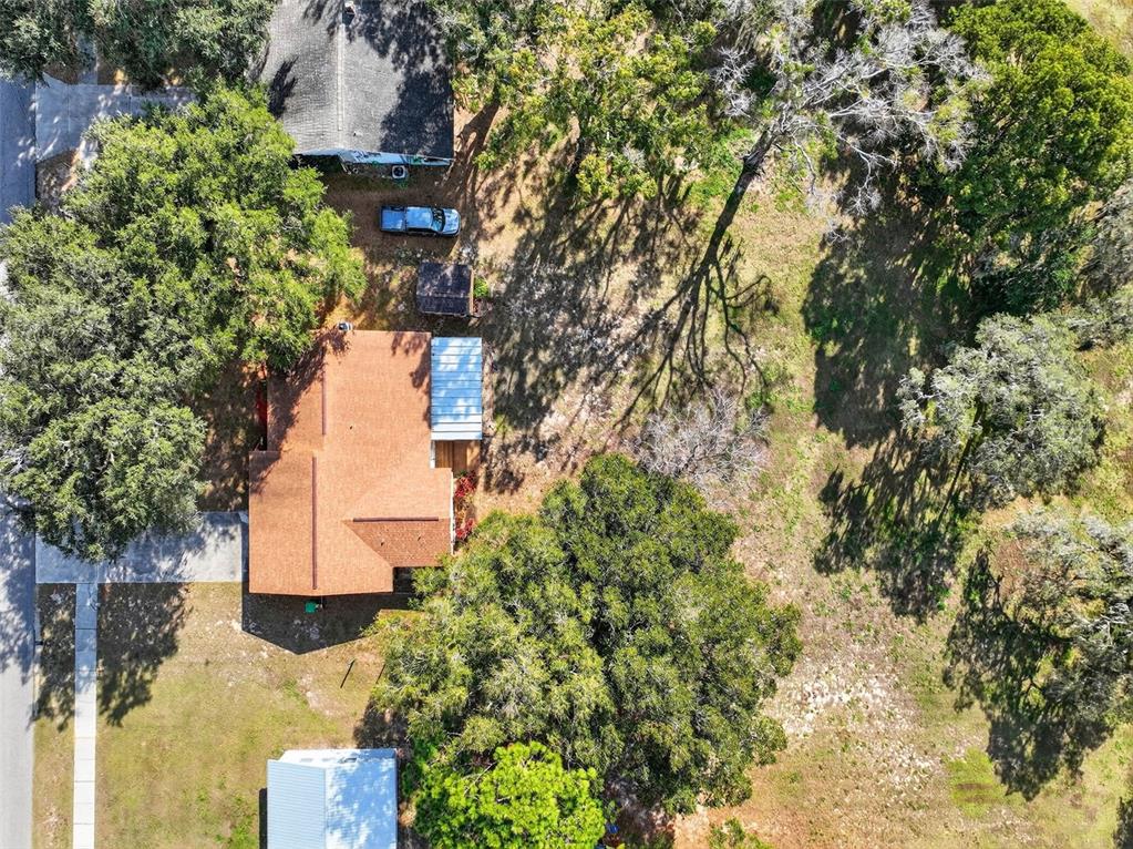 309 North 8th Street Dundee, FL 33838 - Photo 80 of 91 an aerial view of residential house with outdoor space and trees all around