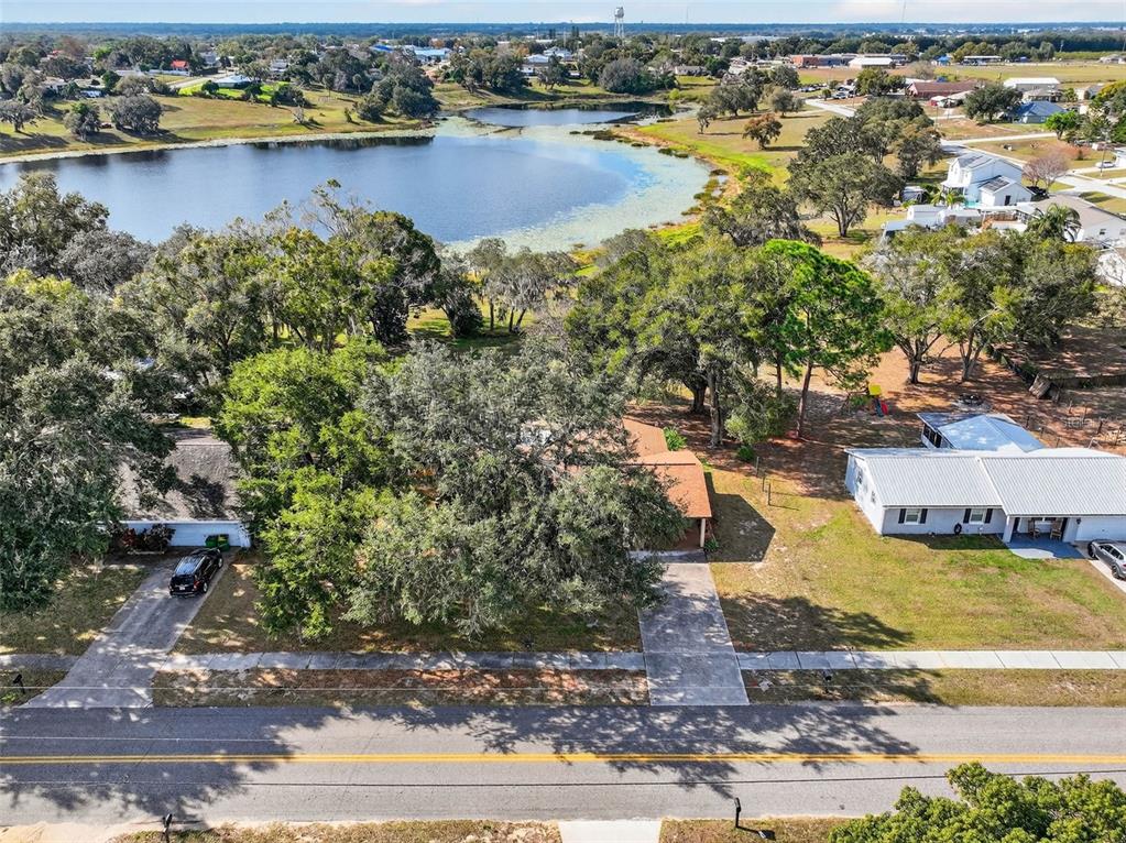 309 North 8th Street Dundee, FL 33838 - Photo 83 of 91 an aerial view of residential houses with outdoor space and lake view