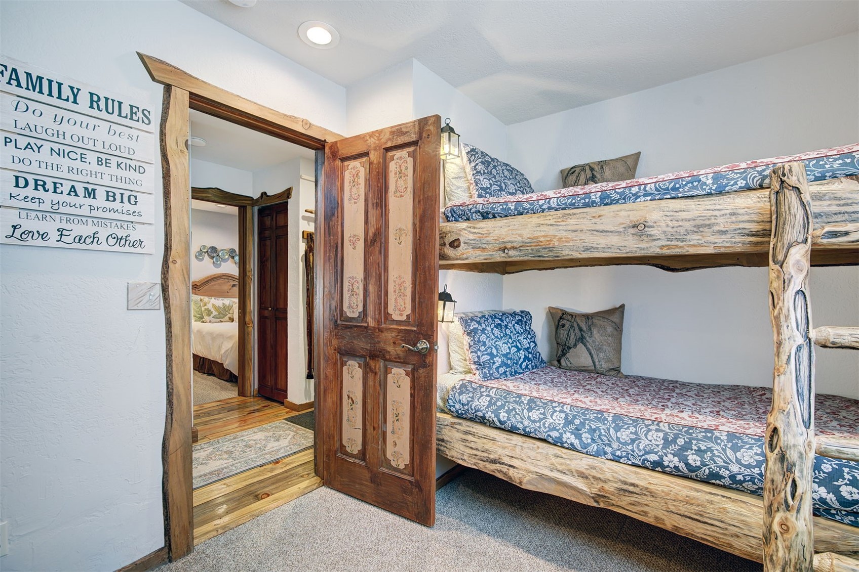9460 Ryan Gulch Road, Unit 9460 Silverthorne, CO 80498 - Photo 27 of 39 a living room with furniture and a dresser