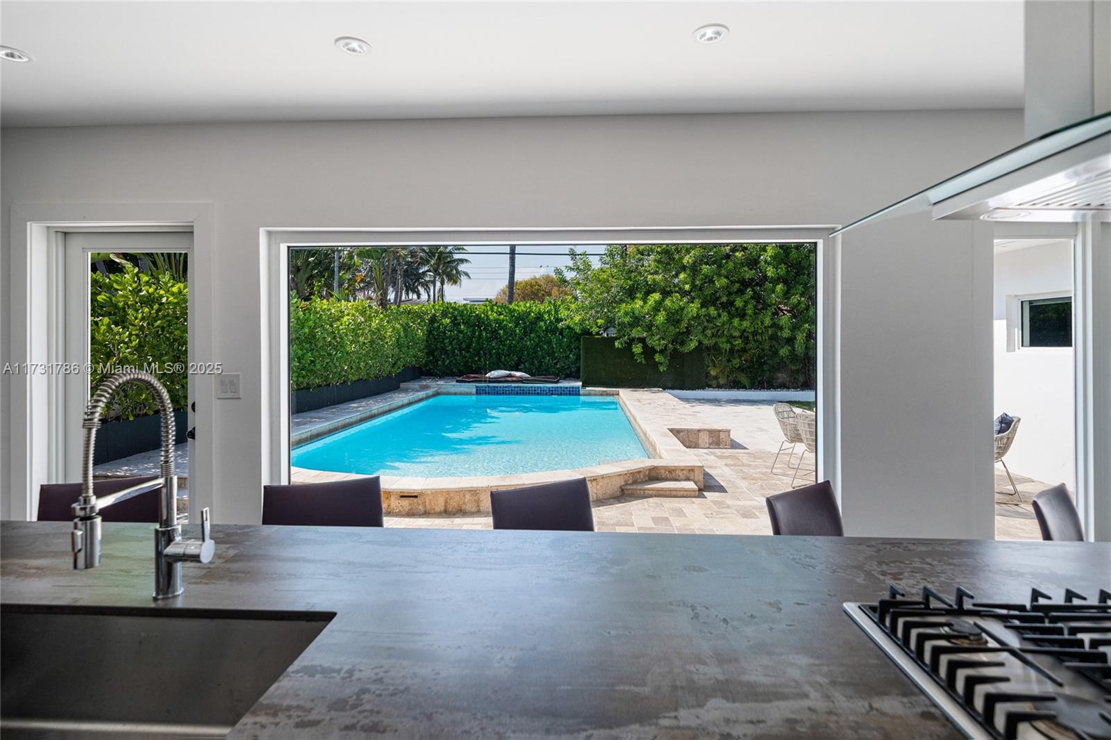835 Fairway Drive Miami Beach, FL 33141 - Photo 14 of 39 a living room with large window