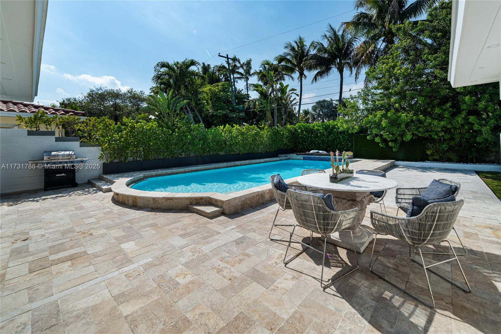 835 Fairway Drive Miami Beach, FL 33141 - Photo 16 of 39 a view of an outdoor space with lounge chair