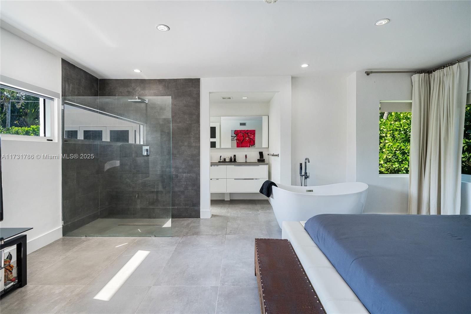835 Fairway Drive Miami Beach, FL 33141 - Photo 23 of 39 a living room with stainless steel appliances furniture a rug and a window