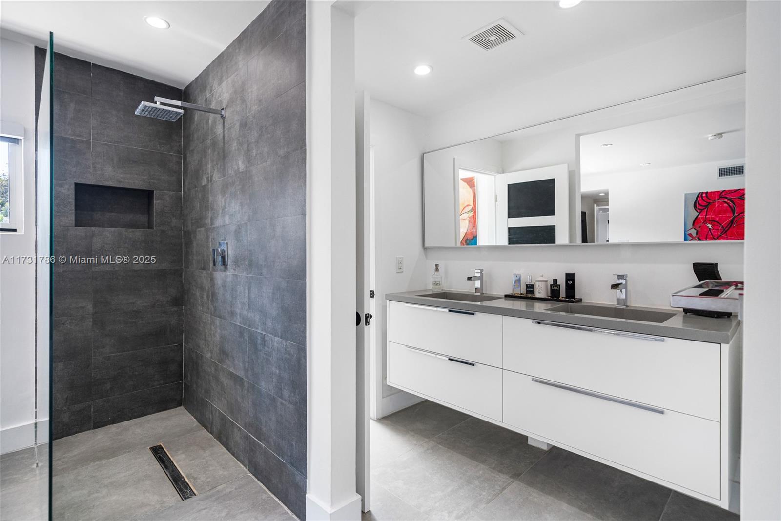 835 Fairway Drive Miami Beach, FL 33141 - Photo 24 of 39 a bathroom with a sink and a mirror