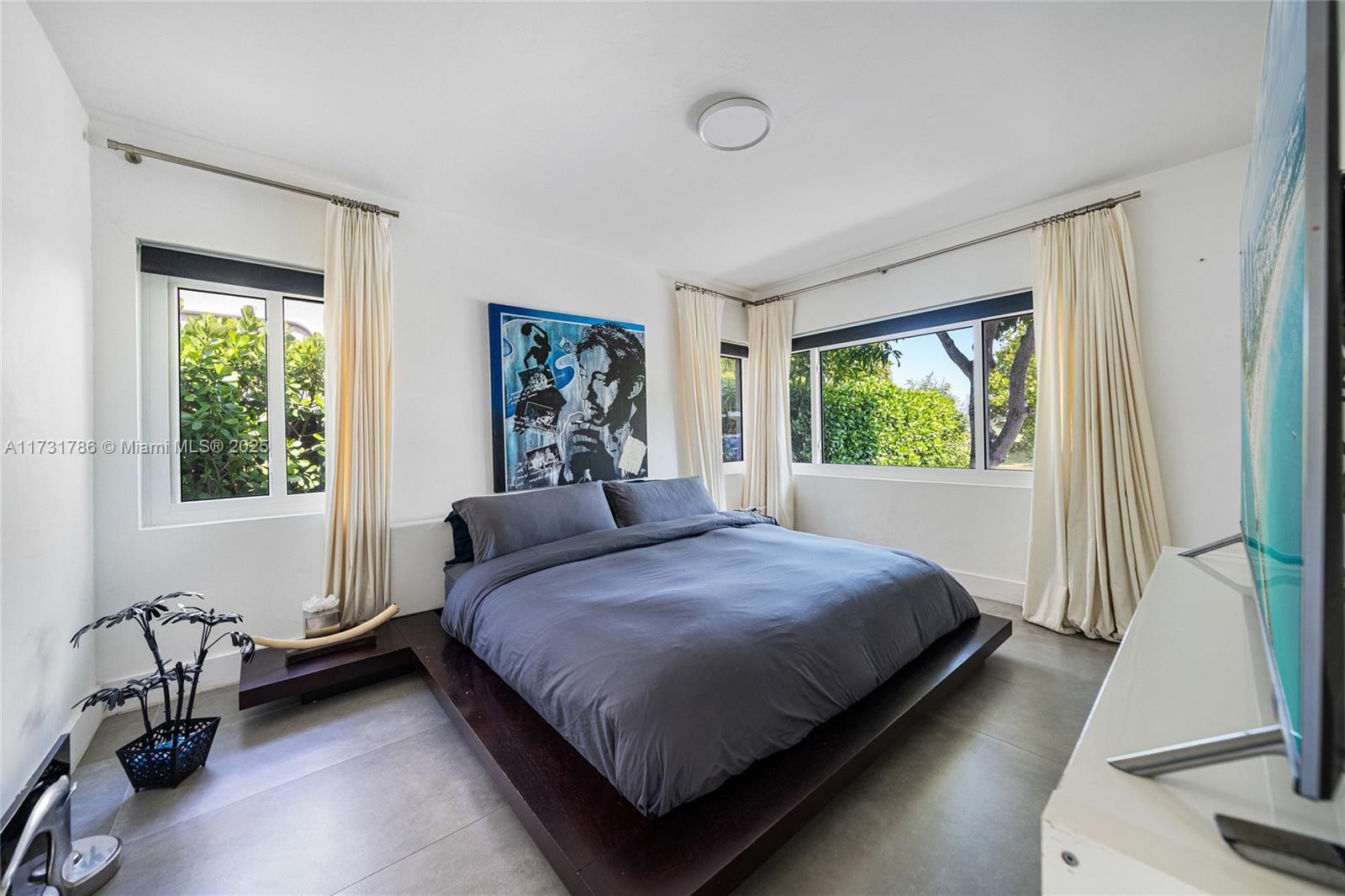 835 Fairway Drive Miami Beach, FL 33141 - Photo 27 of 39 a bedroom with a bed and a window