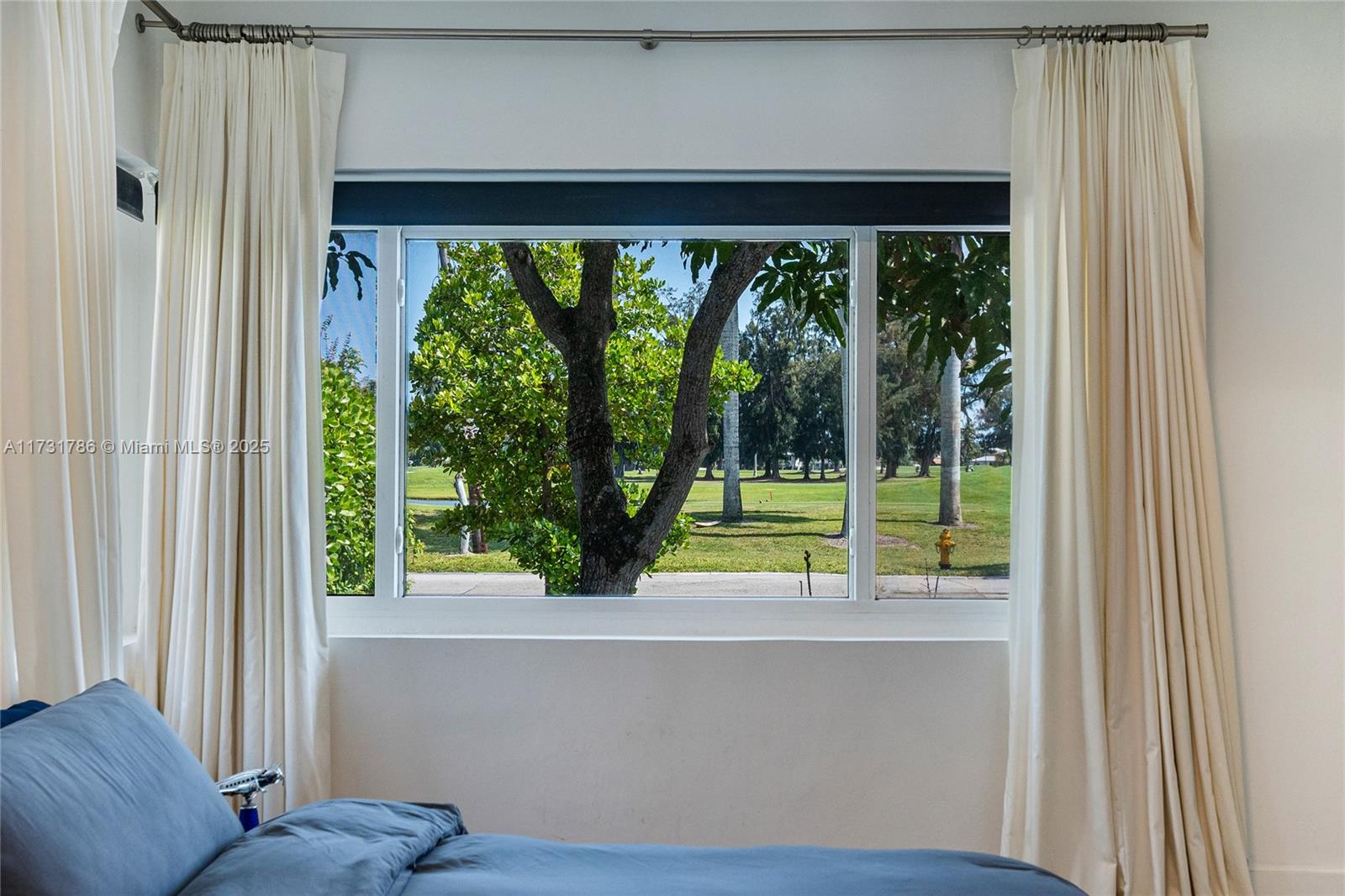 835 Fairway Drive Miami Beach, FL 33141 - Photo 28 of 39 a view of a room that has a bed and a large window