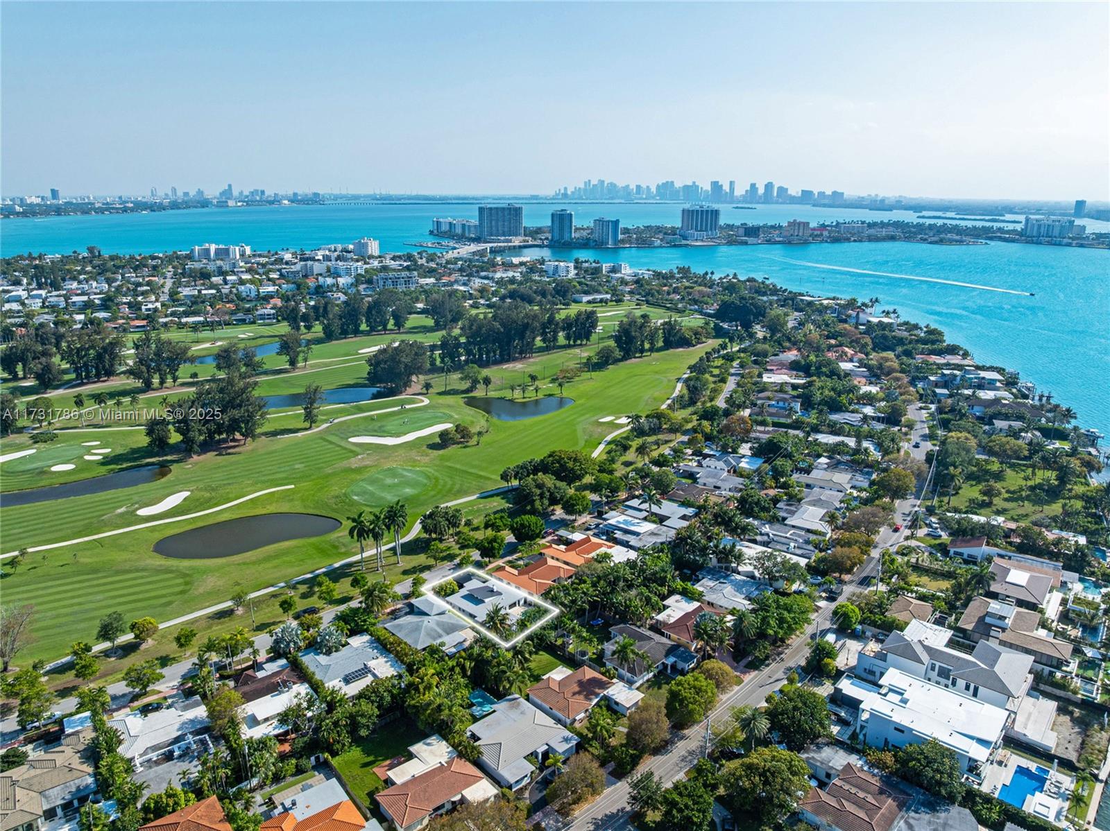 835 Fairway Drive Miami Beach, FL 33141 - Photo 36 of 39 an aerial view of a city with lots of residential buildings and mountain view in back