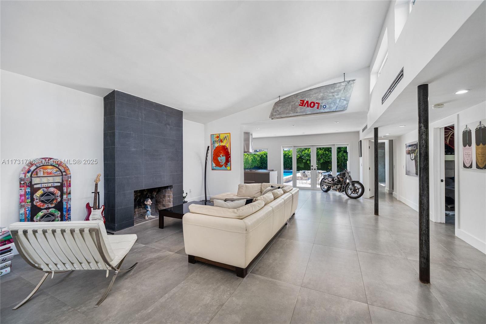 835 Fairway Drive Miami Beach, FL 33141 - Photo 5 of 39 a living room with furniture and a wooden floor