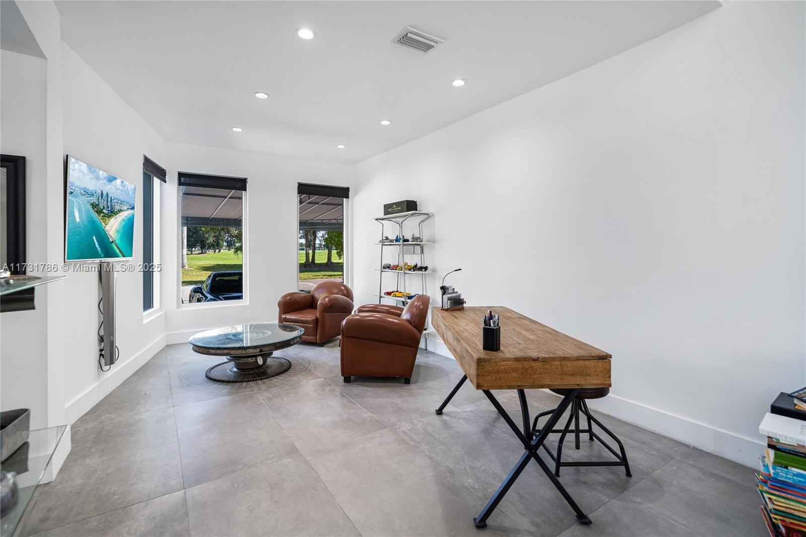 835 Fairway Drive Miami Beach, FL 33141 - Photo 7 of 39 a living room with furniture and a window