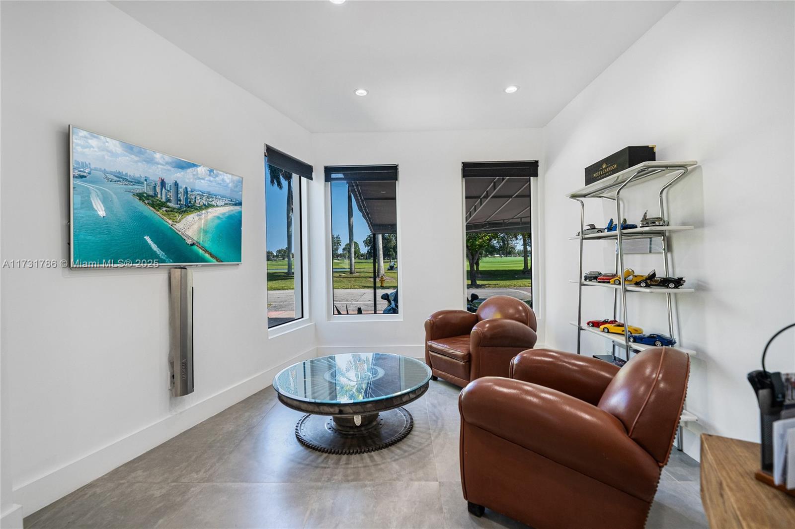 835 Fairway Drive Miami Beach, FL 33141 - Photo 8 of 39 a living room with furniture and a large window