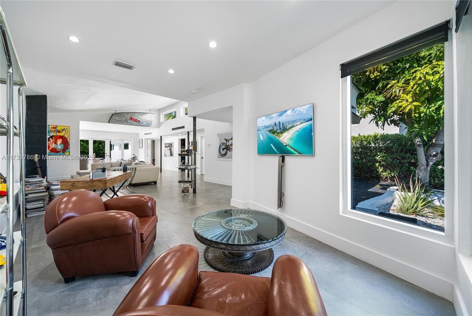 835 Fairway Drive Miami Beach, FL 33141 - Photo 9 of 39 a living room with furniture and a large window