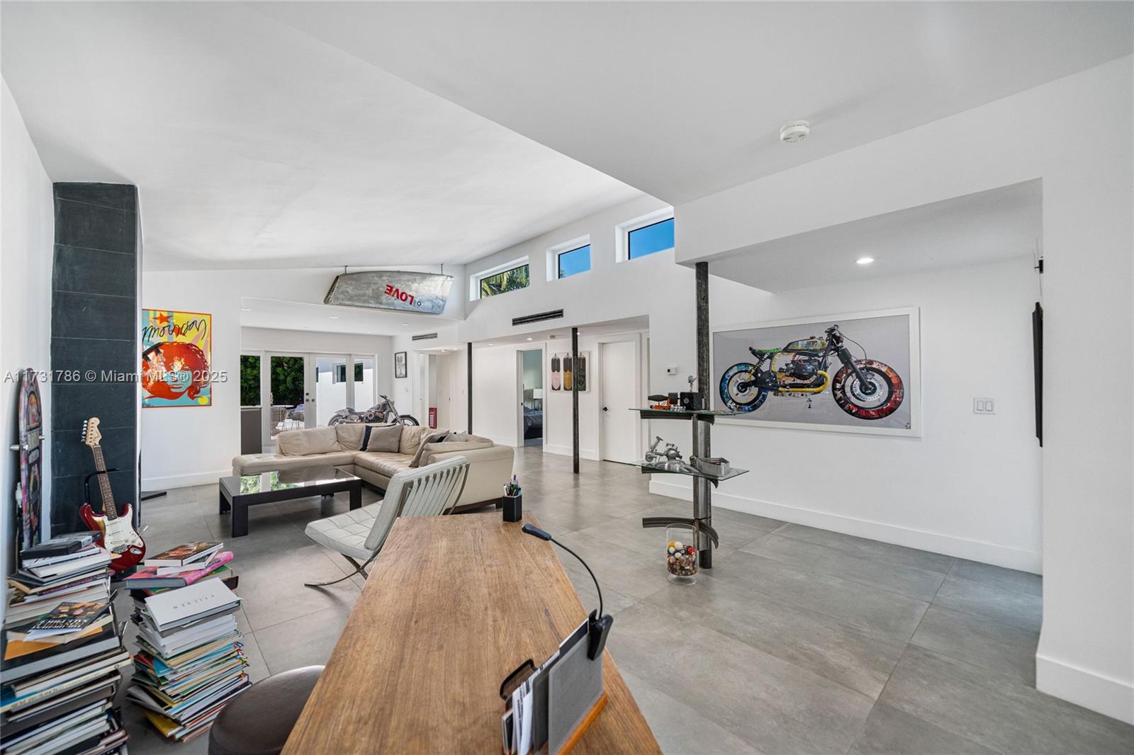 835 Fairway Drive Miami Beach, FL 33141 - Photo 10 of 39 a view of a livingroom with furniture and a rug