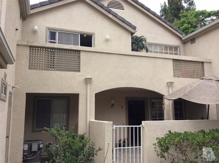 1175 Fitzgerald Road, Unit E Simi Valley, CA 93065 - Photo 1 of 24 a front view of a house with plants