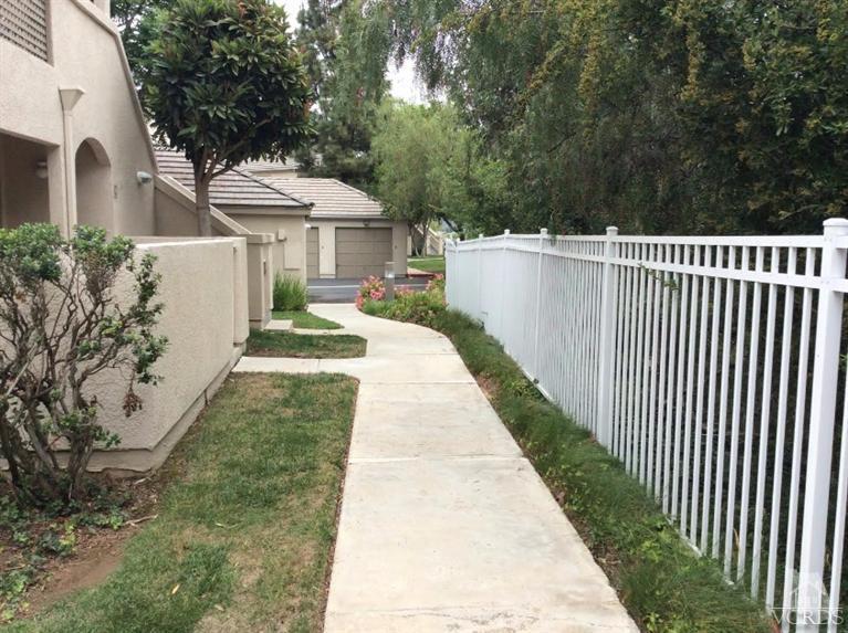 1175 Fitzgerald Road, Unit E Simi Valley, CA 93065 - Photo 11 of 24 a front view of a house with a yard