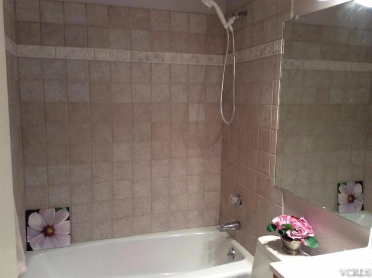 1175 Fitzgerald Road, Unit E Simi Valley, CA 93065 - Photo 14 of 24 a bathroom with a shower