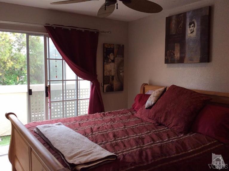 1175 Fitzgerald Road, Unit E Simi Valley, CA 93065 - Photo 18 of 24 a bed sitting in a bedroom next to a window