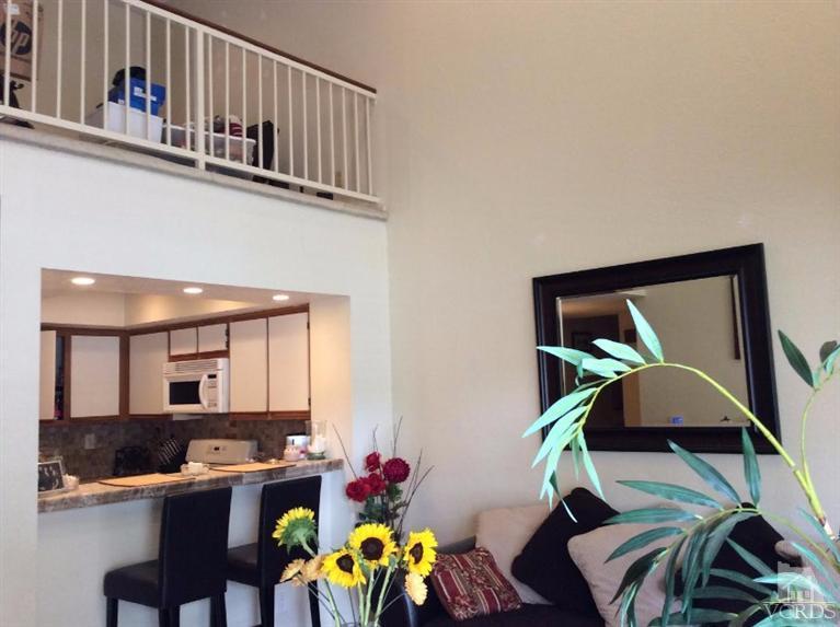1175 Fitzgerald Road, Unit E Simi Valley, CA 93065 - Photo 3 of 24 a dining room with furniture and a potted plant