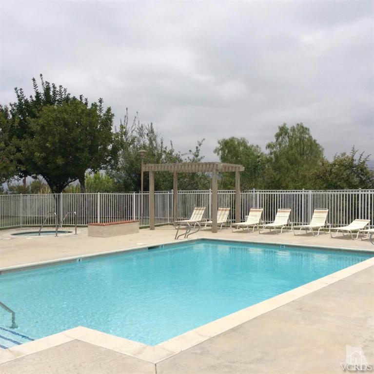 1175 Fitzgerald Road, Unit E Simi Valley, CA 93065 - Photo 21 of 24 a view of a swimming pool with a yard