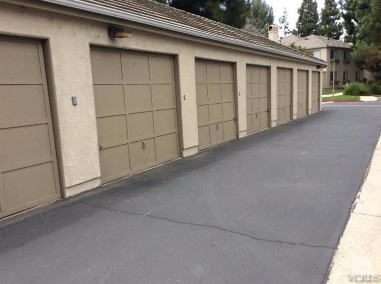 1175 Fitzgerald Road, Unit E Simi Valley, CA 93065 - Photo 23 of 24 a view of a house with garage