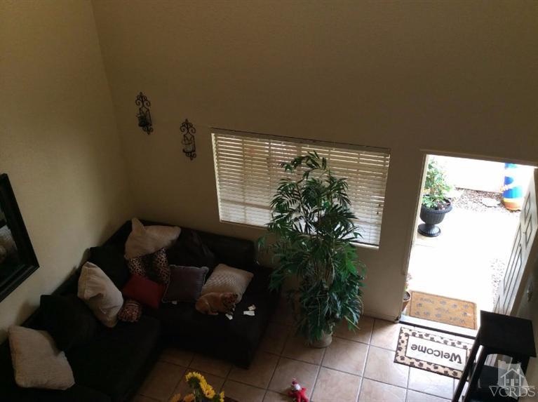 1175 Fitzgerald Road, Unit E Simi Valley, CA 93065 - Photo 8 of 24 a living room with furniture and a potted plant