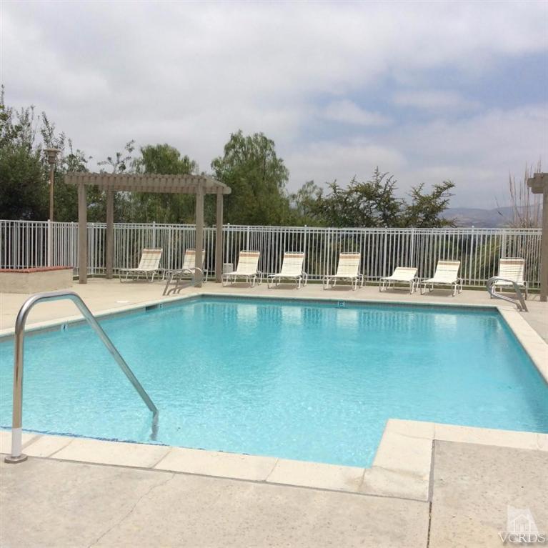 1175 Fitzgerald Road, Unit E Simi Valley, CA 93065 - Photo 10 of 24 a view of a swimming pool with a lake view