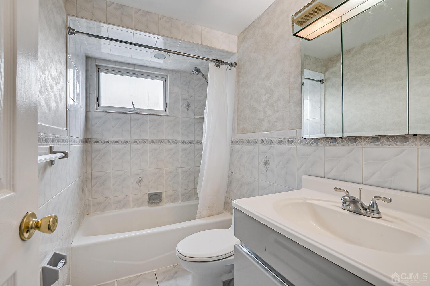 62 Hickory Road Colonia, NJ 07067 - Photo 16 of 23 a bathroom with a sink a toilet and shower