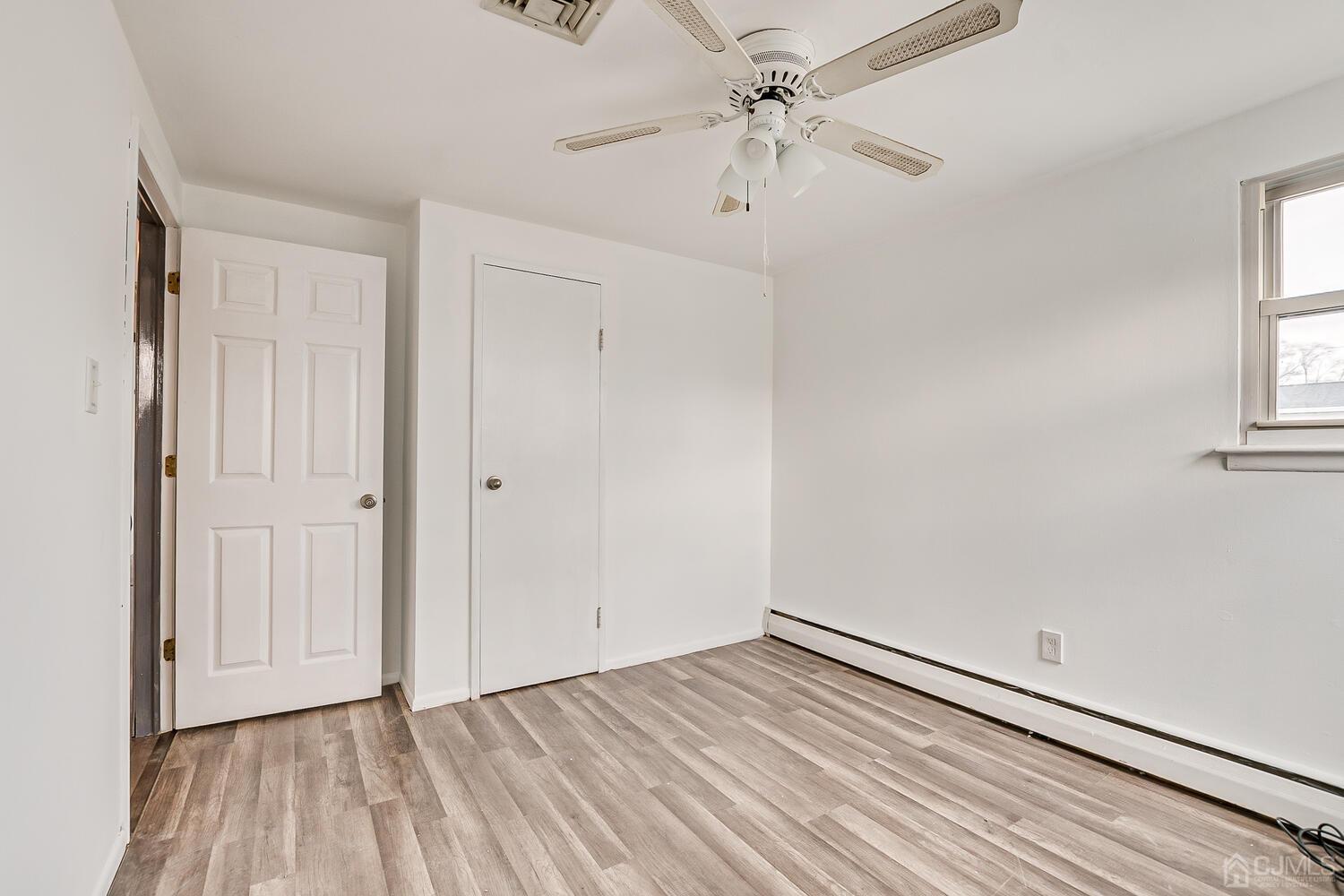 62 Hickory Road Colonia, NJ 07067 - Photo 18 of 23 a view of an empty room with a window