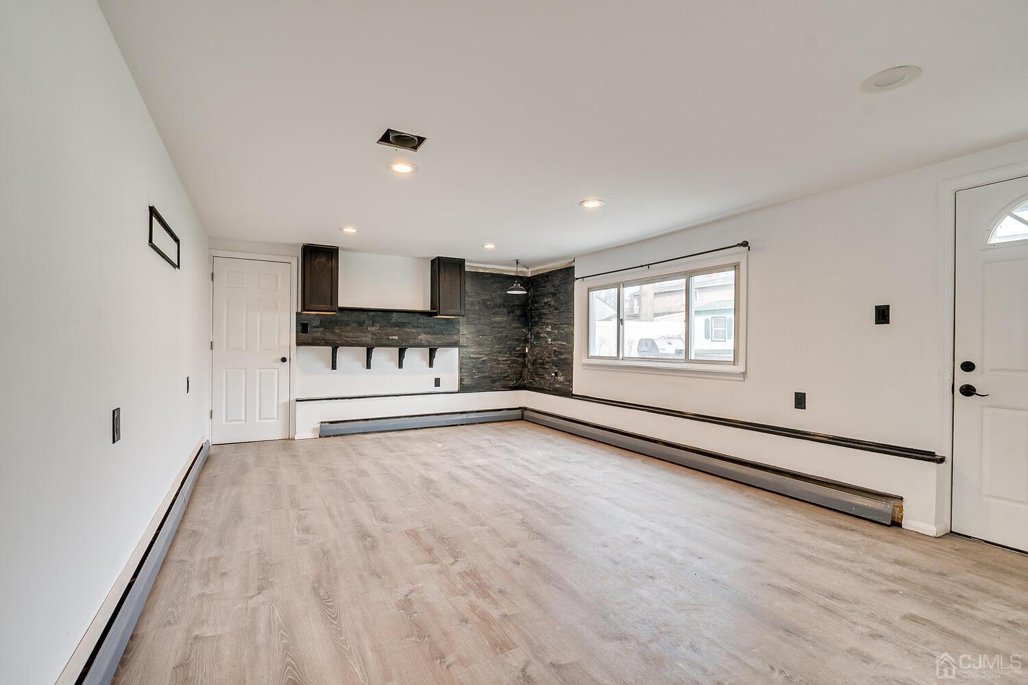 62 Hickory Road Colonia, NJ 07067 - Photo 9 of 23 a view of a room with window and wooden floor