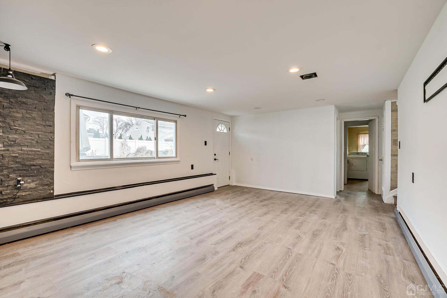62 Hickory Road Colonia, NJ 07067 - Photo 10 of 23 a view of an empty room with a window