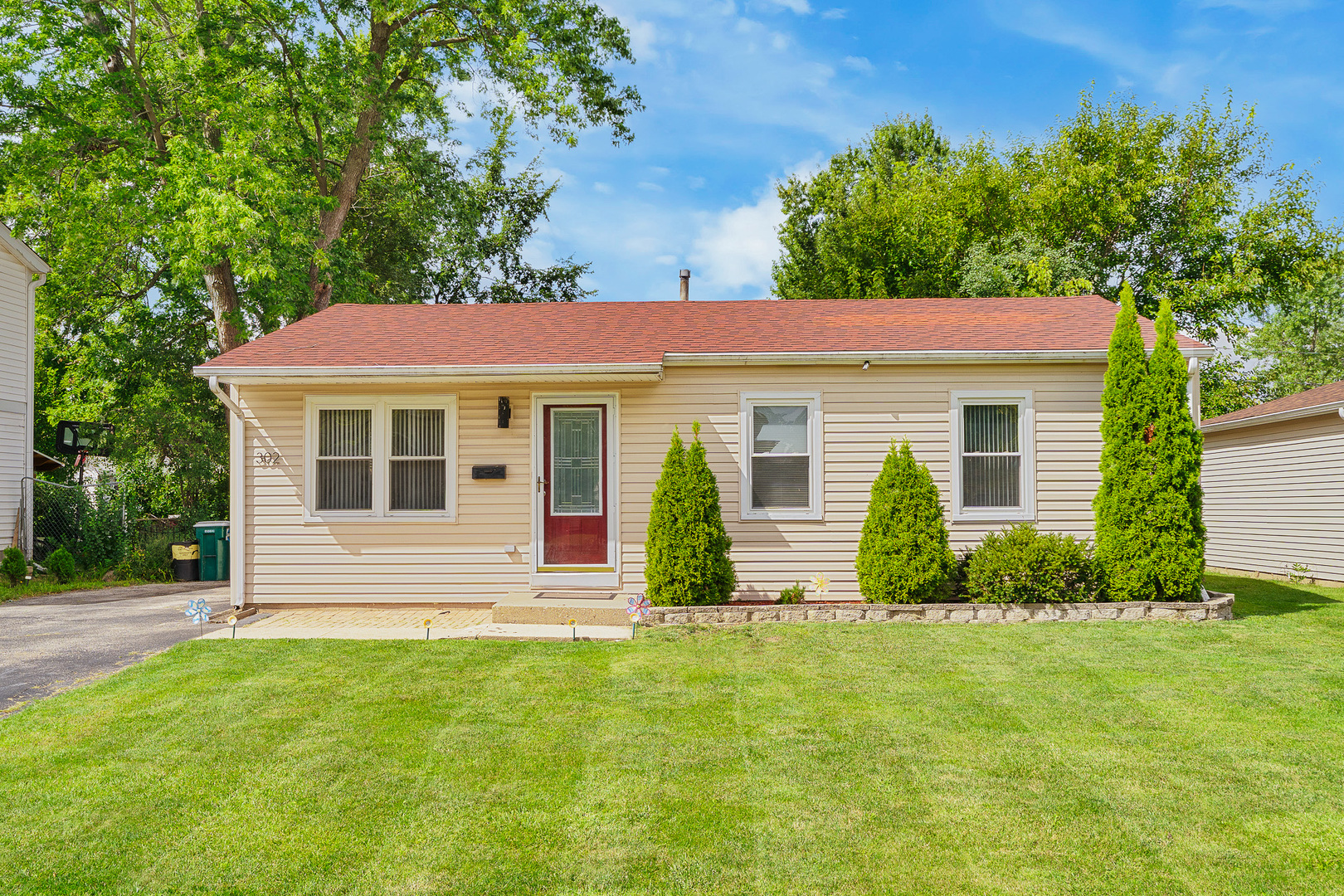 302 South Oltendorf Road Streamwood, IL 60107 - Photo 1 of 19 a front view of a house with a yard
