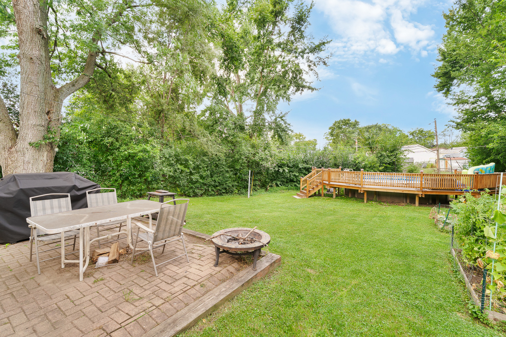 302 South Oltendorf Road Streamwood, IL 60107 - Photo 15 of 19 a view of a chair and table on the garden