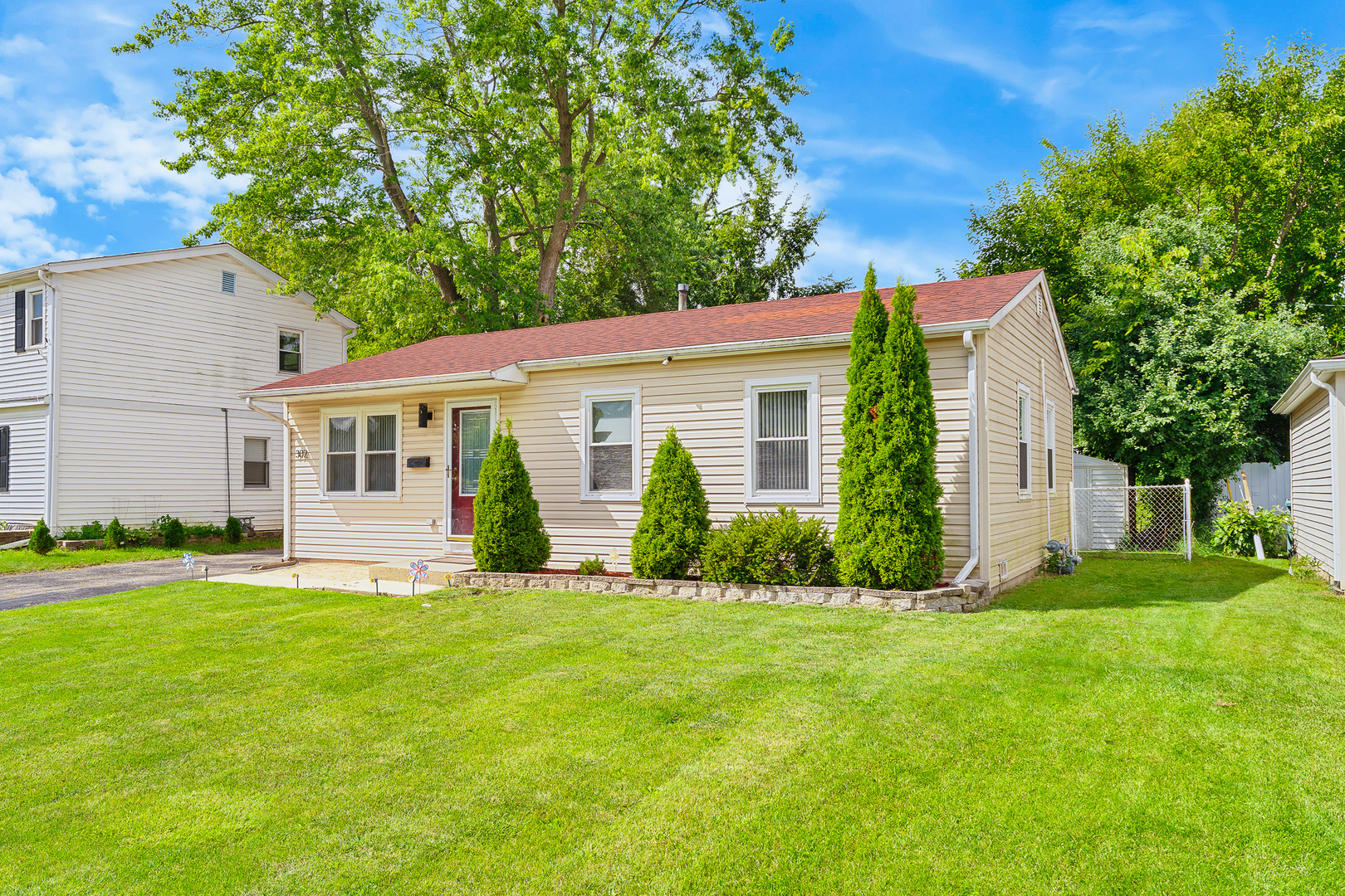 302 South Oltendorf Road Streamwood, IL 60107 - Photo 2 of 19 front view of a house and a yard