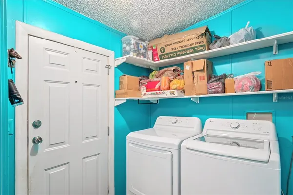 a utility room with dryer and washer