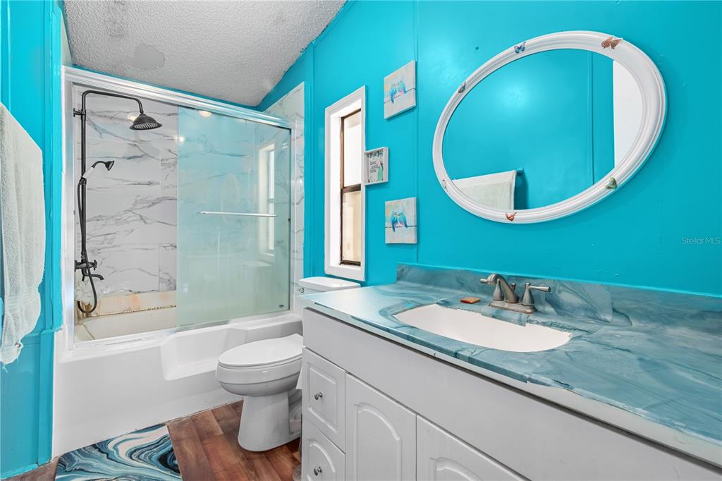 8081 Southwest 41st Place Road Ocala, FL 34481 - Photo 22 of 50 a bathroom with a sink and a mirror