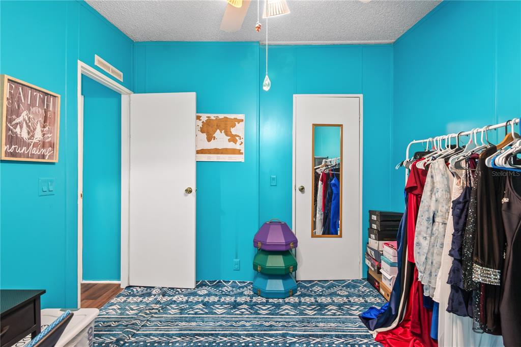 8081 Southwest 41st Place Road Ocala, FL 34481 - Photo 28 of 50 a view of walk in closet with clothes and shoes