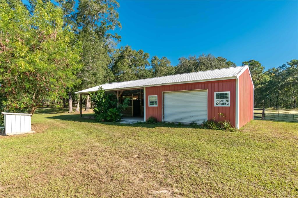 8081 Southwest 41st Place Road Ocala, FL 34481 - Photo 35 of 50 a view of a house with a yard