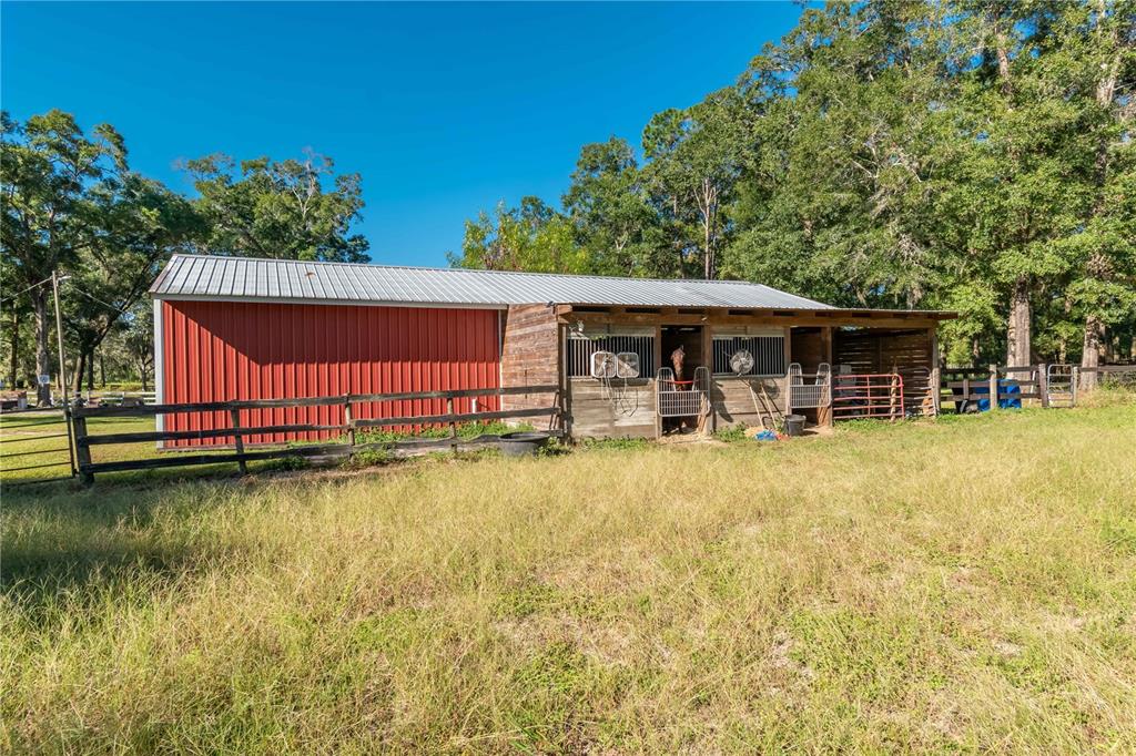 8081 Southwest 41st Place Road Ocala, FL 34481 - Photo 41 of 50 a front view of a house with garden