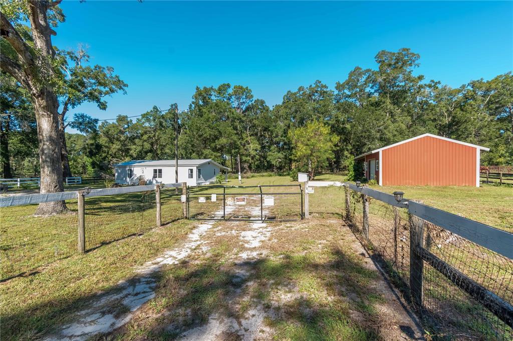 8081 Southwest 41st Place Road Ocala, FL 34481 - Photo 46 of 50 a view of a swimming pool with a patio