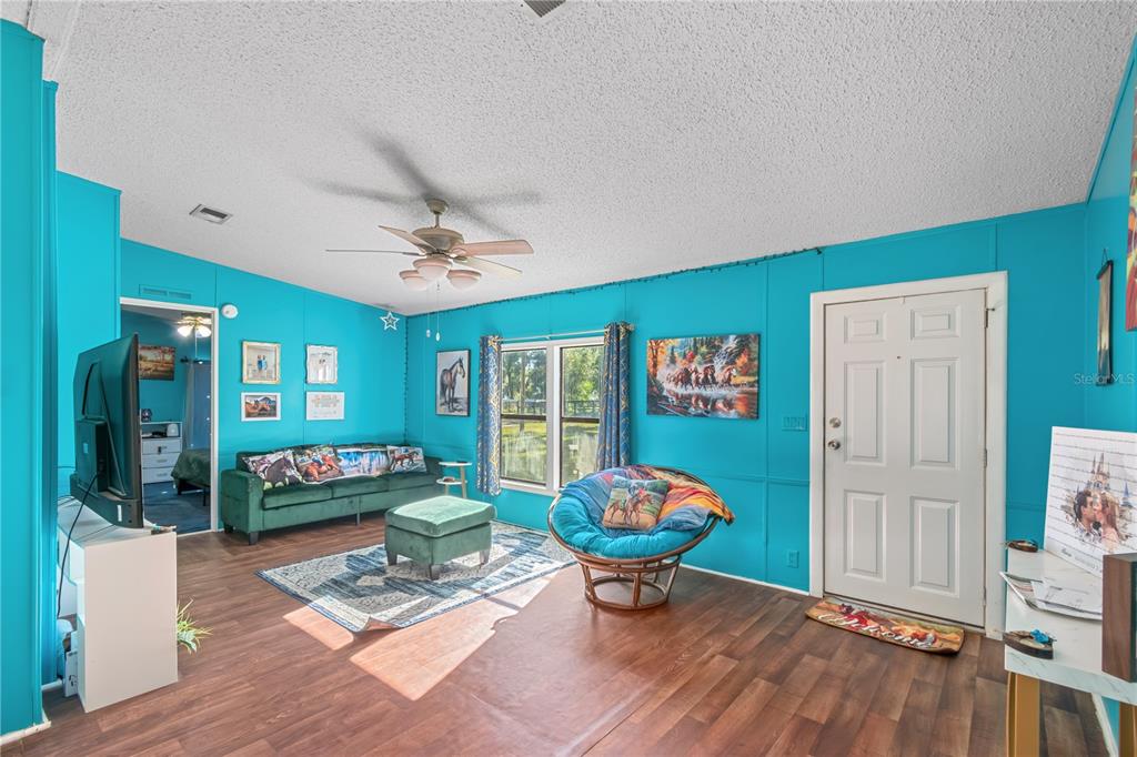 8081 Southwest 41st Place Road Ocala, FL 34481 - Photo 6 of 50 a outdoor space with furniture and garden view